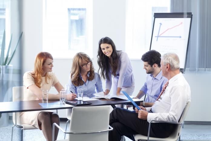 Salespeople meeting in a conference room